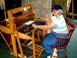 Laura operating the loom