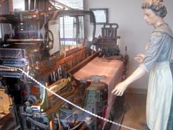 ONE OF THE OLD LOOMS WITH MANNEQUIN